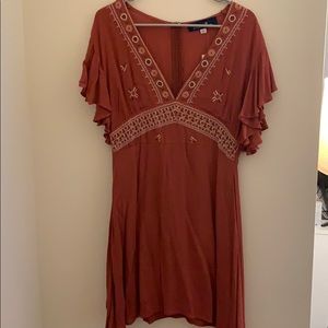 Francesca’s burnt orange dress